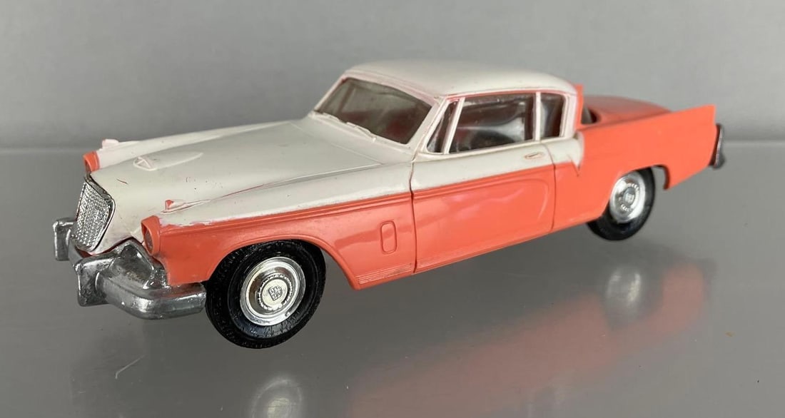 AMT 1957 Studebaker Golden Hawk Dealership Promo Car: Coral / white, wavy windows, coaster, some scratches