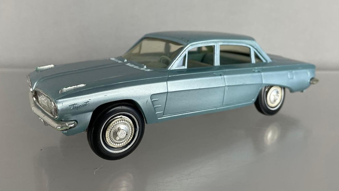 1961 Pontiac Tempest Dealership Promo Car: Steel blue, friction motor works - wobbly wheels, scratches especially on roof
