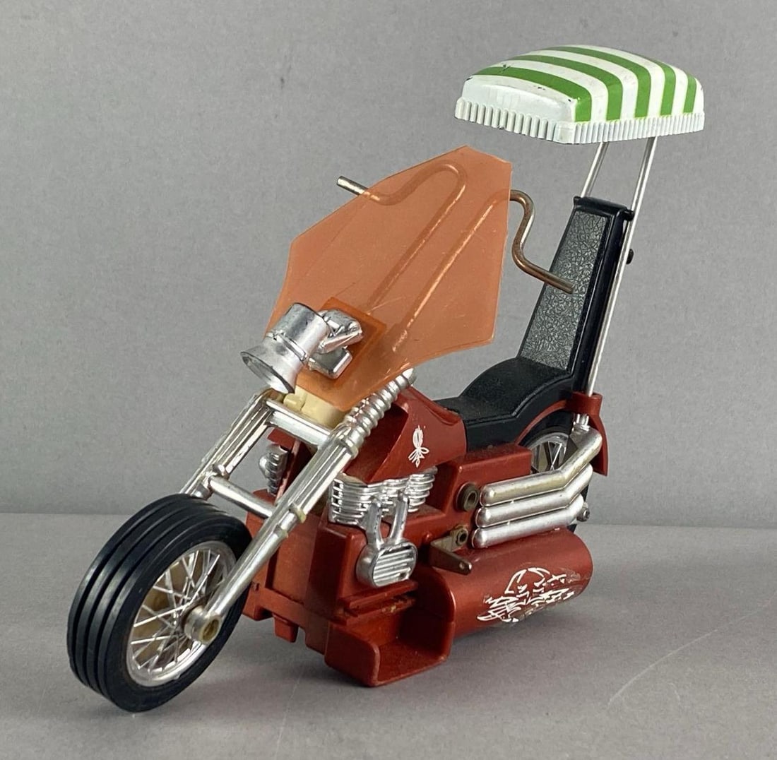 1971 Hasbro Screamn Demons Battery Operated Toy Chopper: In working condition, some wear to stickers and roof, measures 5 inches H x 2 1/4 inches W x 7 inches D