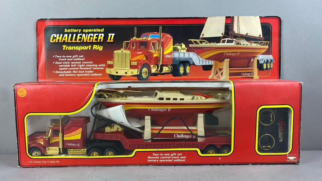 1985 New Bright Battery Operated Challenger II Transport Rig: Like new in original packaging. Measures H 7 x W 4 x L 24 inches.