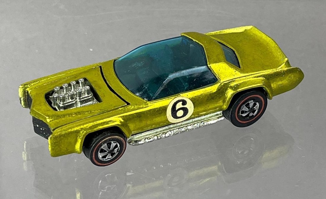 1969 Mattel Hot Wheels Redline Sugar Caddy Die-Cast Vehicle: Yellow Spectraflame, black interior, blue windows.