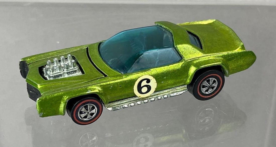 1969 Mattel Hot Wheels Redline Sugar Caddy Die-Cast Vehicle: Green Spectraflame, black interior, blue windows.