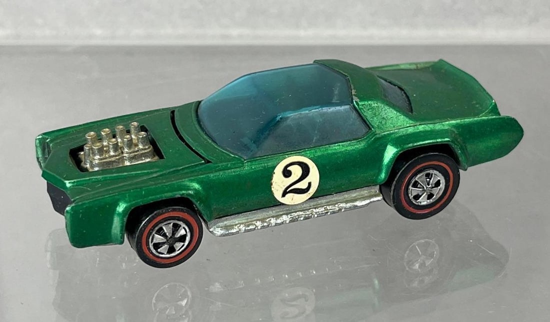 1969 Mattel Hot Wheels Redline Sugar Caddy Die-Cast Vehicle: Green Spectraflame, black interior, blue windows.