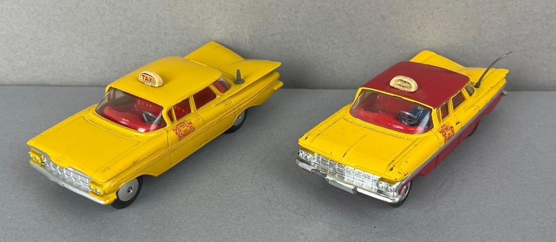 Group of 2 Corgi Chevrolet Impala Taxi Die-Cast Vehicles: 1/43 scale. One antenna is broken off.
