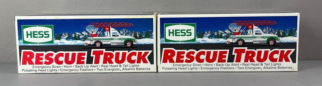 Group of 2 Hess Rescue Battery Operated Trucks: In original packaging.