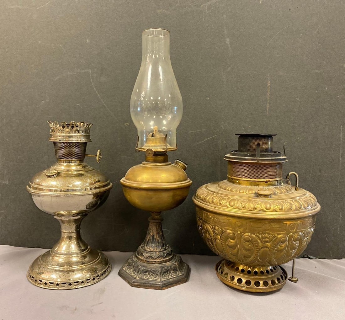 Group of 3 Antique Oil Lamps: Largest measures 18 inches tall.