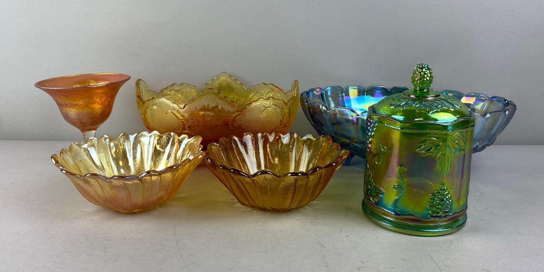 Group of 6 Carnival Glass Bowls and More: Include Jar, Stem Glass, and more. Largest measures 12 inches in length.