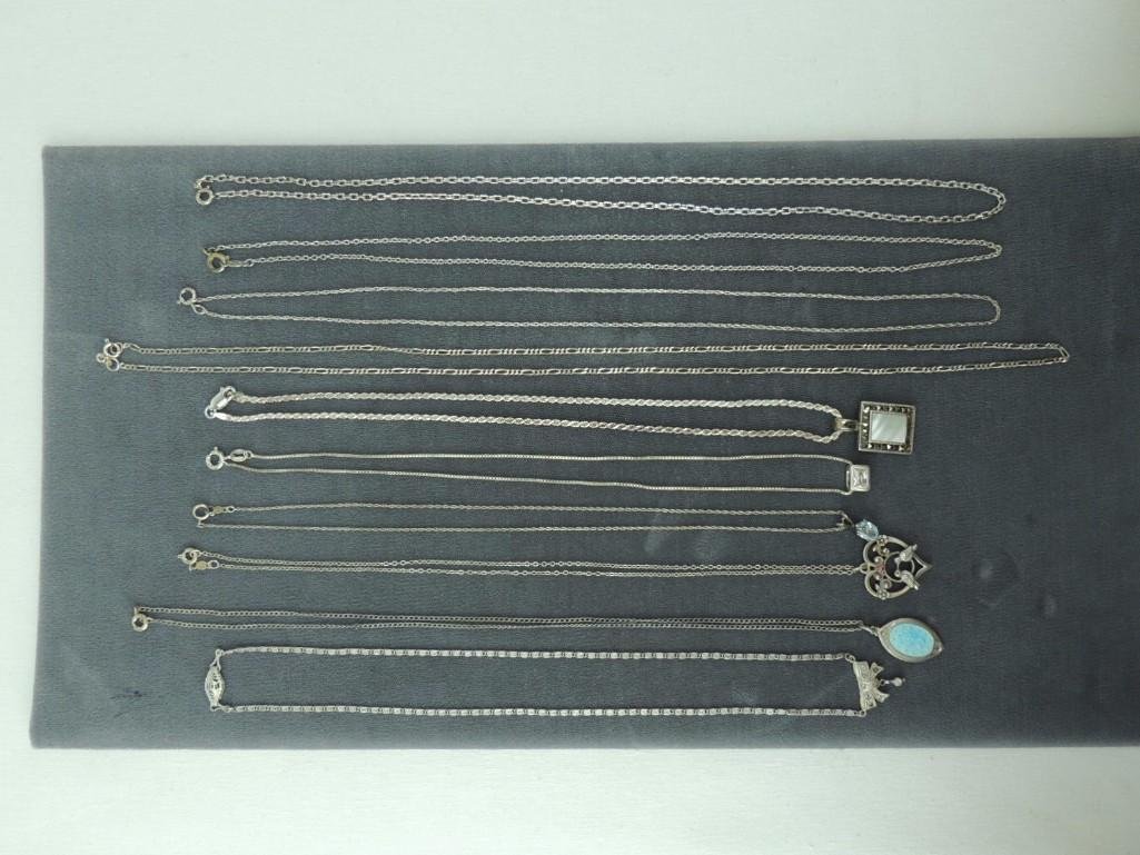 10 Sterling Silver Chains: Bow 16", Religious 18", Heart 16", Oval Blue Stone 16", Rectangle CZ 16", Hematite/Shell 16", 3-1 Figaro 23", Fine Rope 20", Rolo 19.75",Rolo 20"