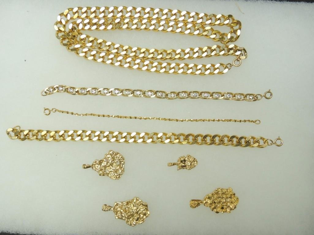 Group of 14K Gold Layered Jewelry: 1 Neck Chain, 3 Bracelets, 4 Nugget Charms