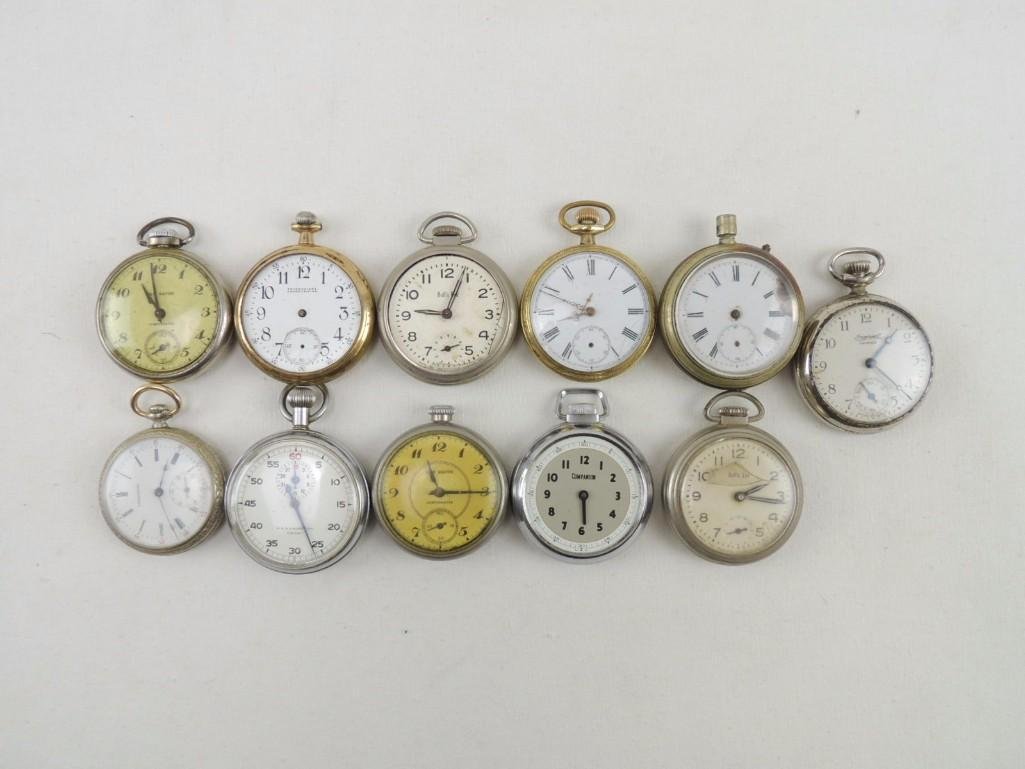 Group of 11 Open Face Pocket Watches: Some Missing Glass Fronts and Backs, All Have Some Damage. Makers Include New Haven, Bill's Eye, Companion Meylan, and More SOLD AS IS