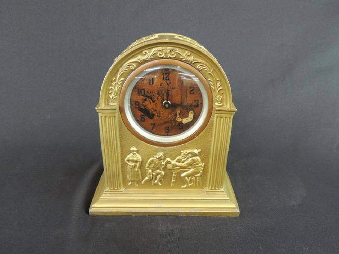 Antique Ornate Brass Clock Featuring Tavern Scene