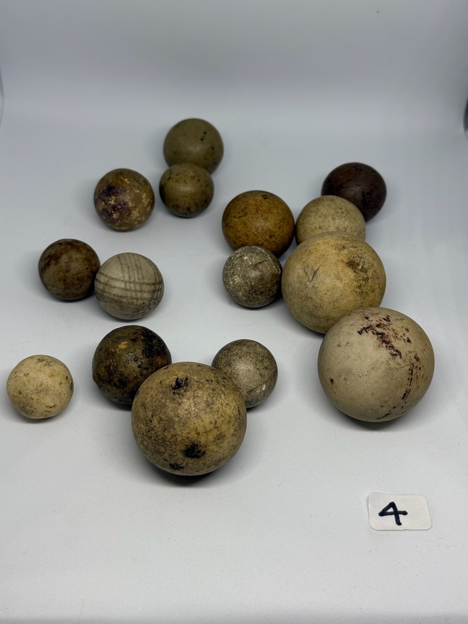 Stone Marbles: Group of old stone marbles. Largest measures 1-1/2 in.