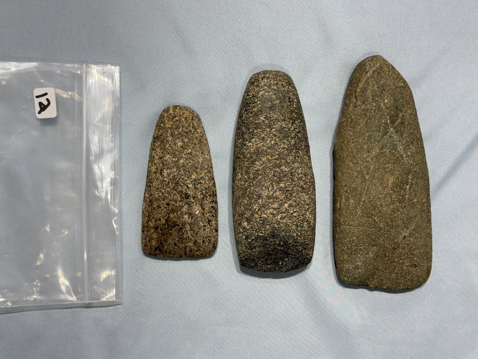 Stone Celts: Three stone celts from Ohio. Largest measures 6-1/4 in.