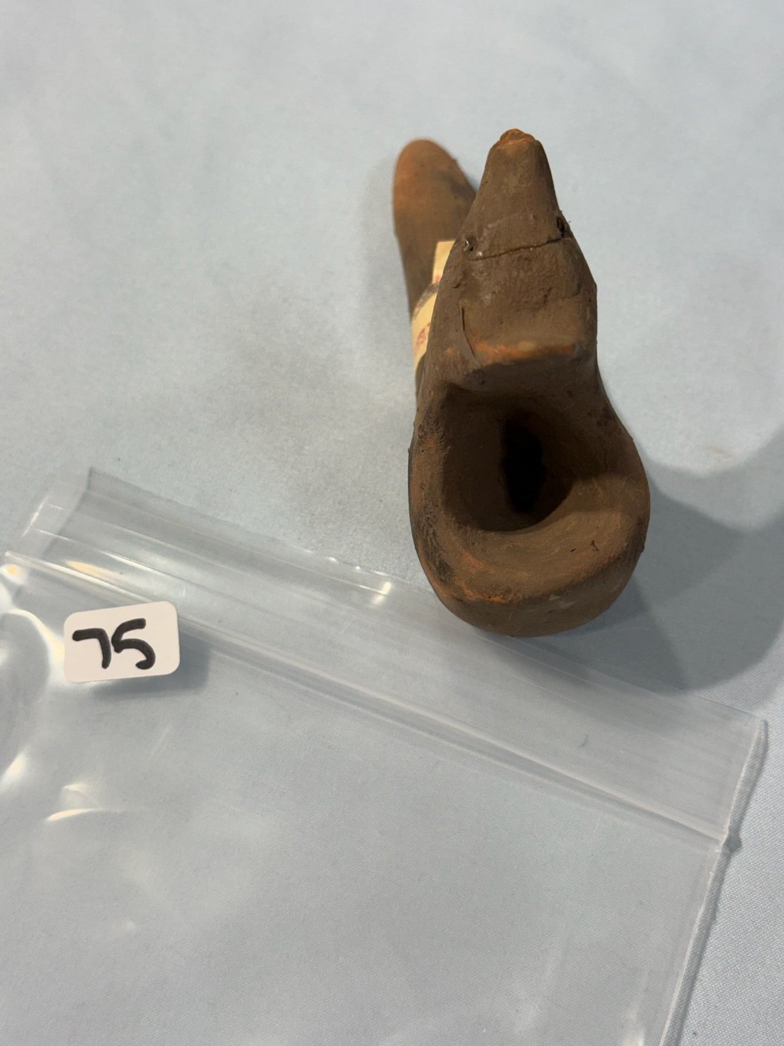 Wolf Pipe: 4 3/4 in. Wolf Effigy Clay Pipe - Broken and Glued - Oklahoma mound sticker.