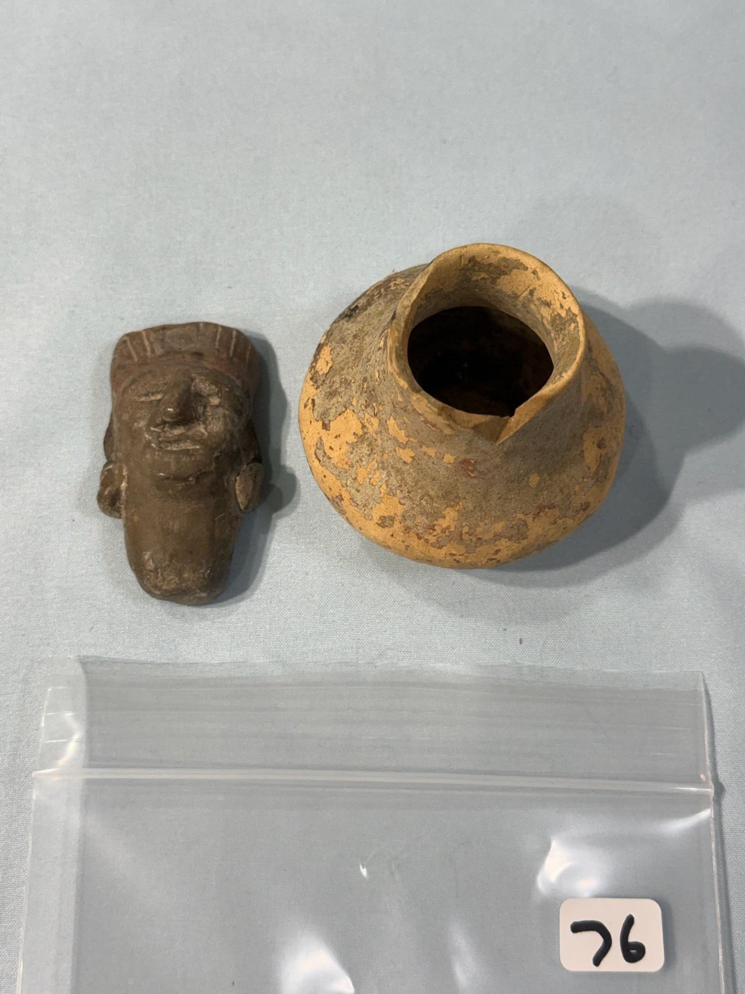 Mini Pottery Jug Little head pendent: Group of 1 2 by 2 1/2 in. Mini Pottery Jug - Ky - Ex M Wilkens, (1) 2 1/2 in. Little head from Mexico.