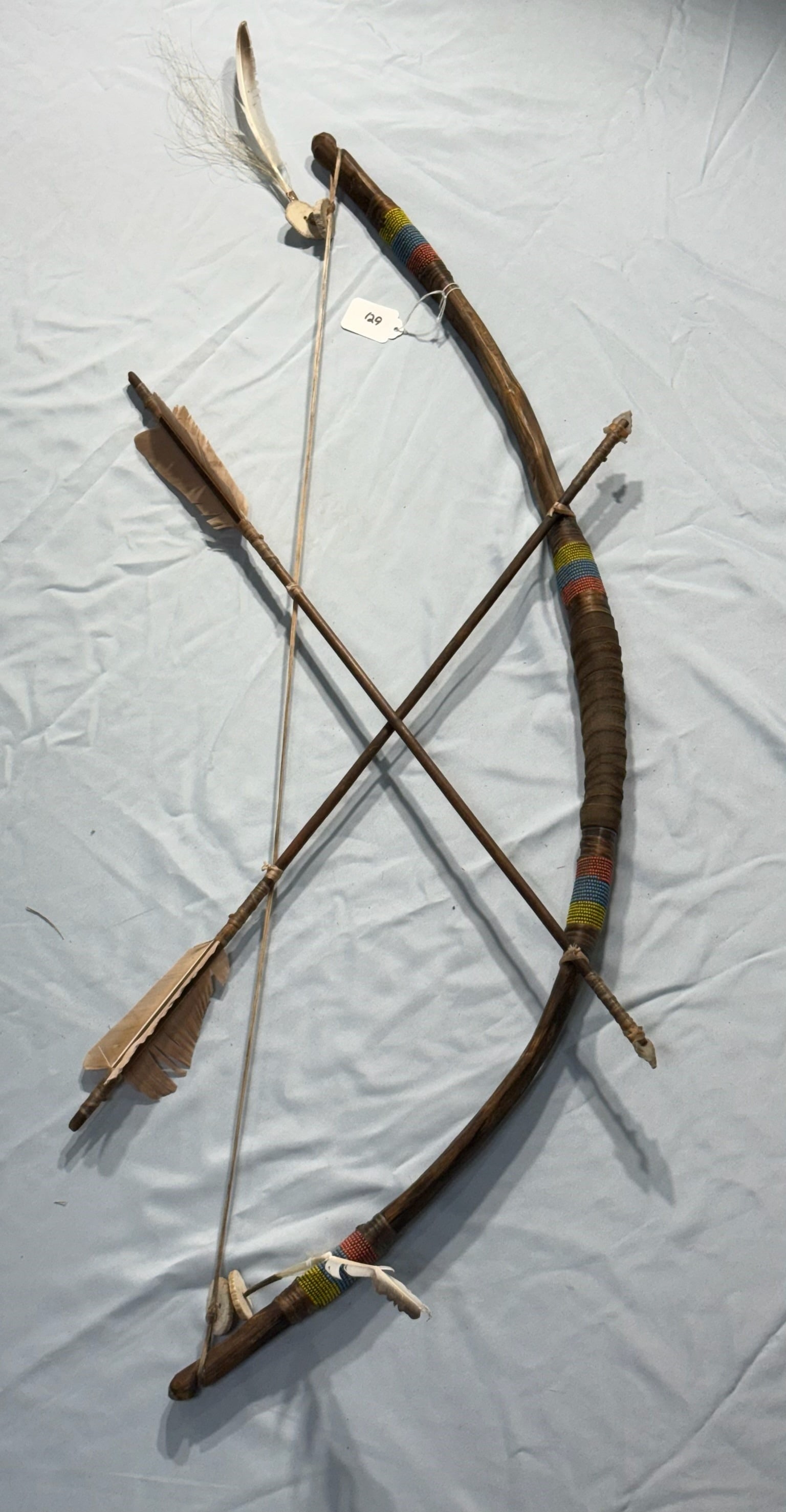 Lizard Rattle: 27 in. Lizard Rattle - Nicely beaded with feathers and horsehair on handle.