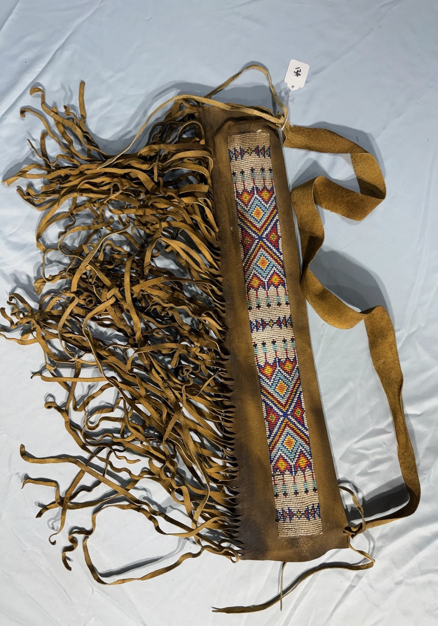 Beaded Quiver with leather fringe: 23 by 6 in. Beaded Quiver with leather fringe - 1930's.
