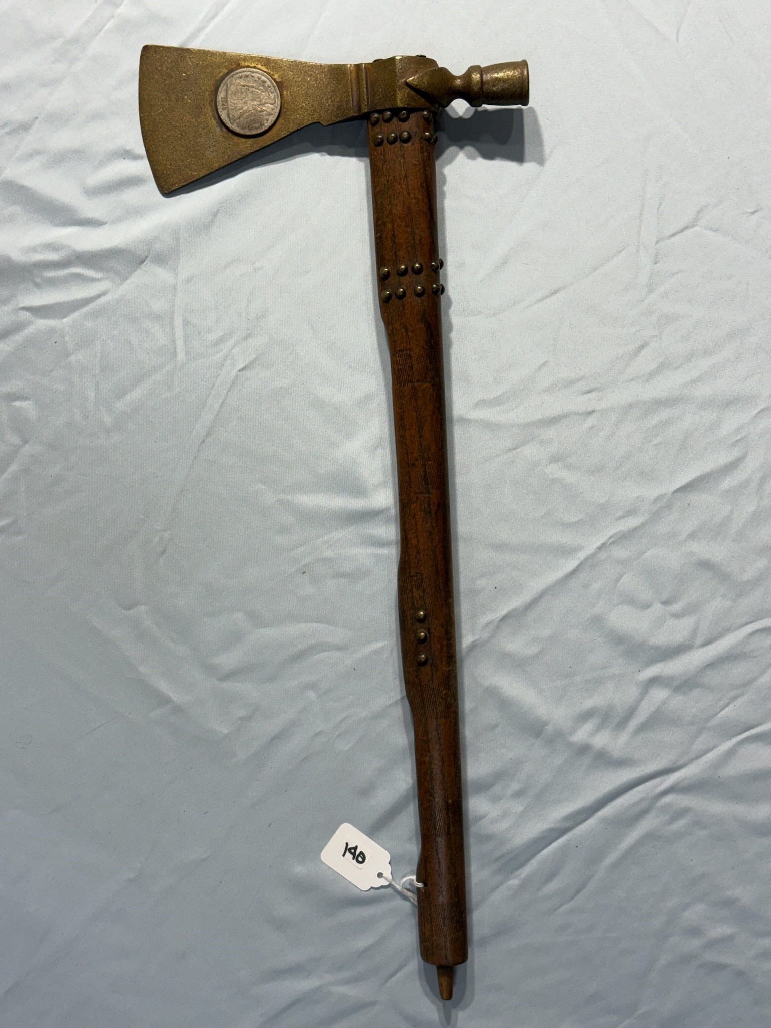Silver dollar Pipe Tomahawk: 21 in. Pipe Silver dollar Tomahawk - beaded handle - 1865 Silver $1 inlay.