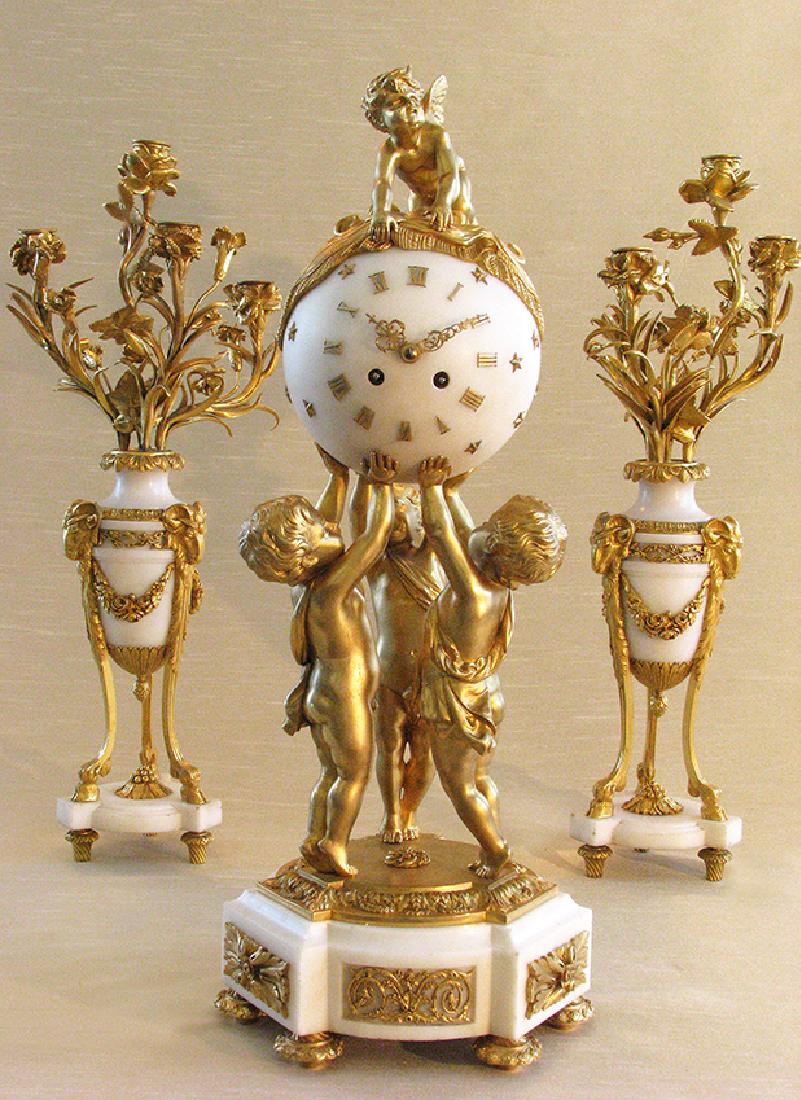 Magnificent French D'Ore Bronze & Marble Clock Set: Antique French Magnificent Bronze D'Ore and Marble Clock Set. The Marble Orb clock is held by three boys tiptoed on a magnificent base decorated with bronze on marble base, and seated on top of the cl