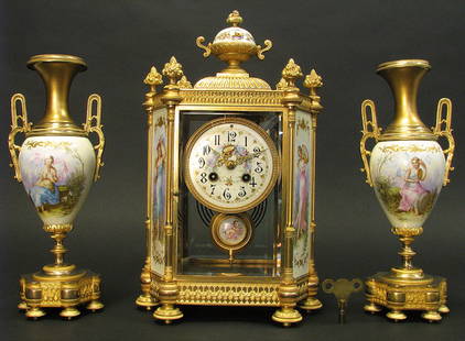 19th C. French Sevres Hand Painted Clock Set: Clock Height: 15"Clock Width: 9"Clock Depth: 6"Garniture Height: 12.1/2"Garniture Diameter: 4.3/4"