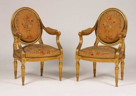 19th C. Pair of Maison Forest Aubusson Arm Chairs: A pair of labeled Maison Forest nineteenth century Louis XVI style armchairs having a giltwood and needlepoint back and seat. All raised on carved tapered legs. Ht: 38.5\" Width: 16.5\" Depth: 20\"