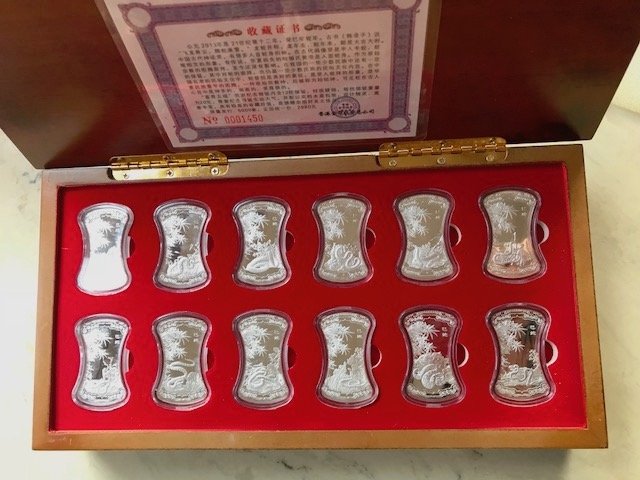 Year of the Snake 12 Silver Bar Set (Ag 20g each): With beautiful workmanship, each silver bar bears a different carved image of the snake. Issued by Hong Kong Gold Coinage Investment Co. Limited edition of 5000.