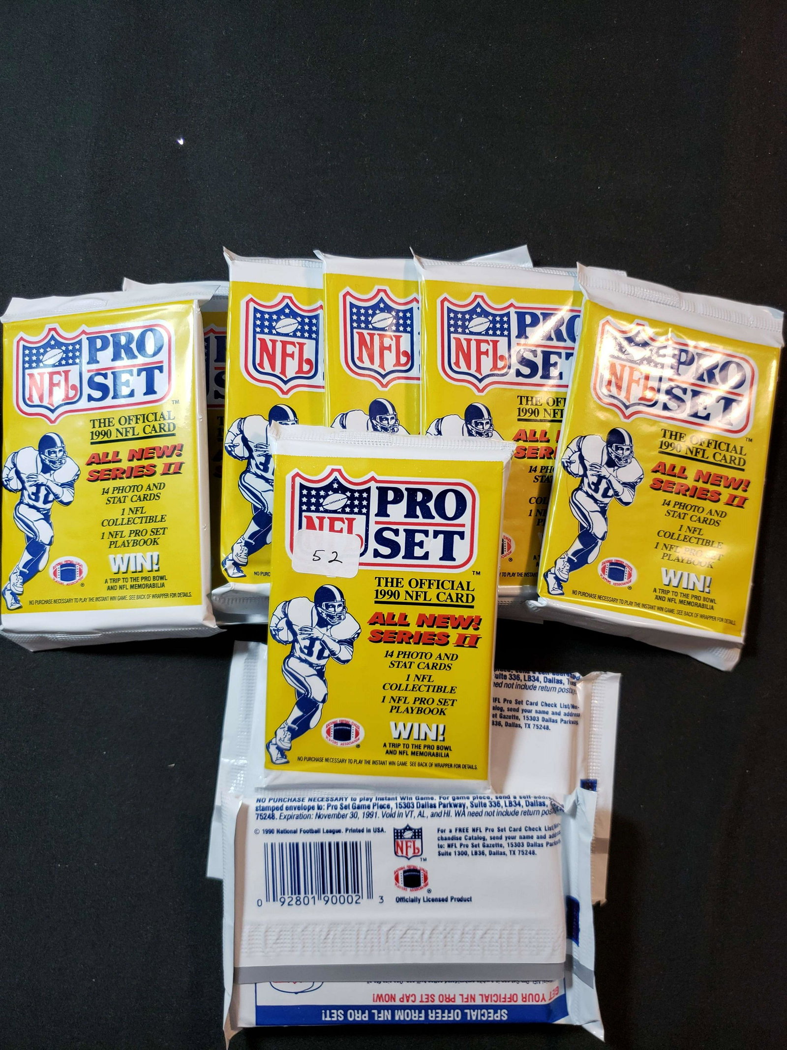 VINTAGE '90S UNOPENED FOOTBALL CARD PACKS: 1990 PRO SET FOOTBALL SERIES 2 (9) SEALED PACKS FIND EMMITT SMITH ROOKIE CARD #685 AND SANTA CLAUS SP CHASE CARDS