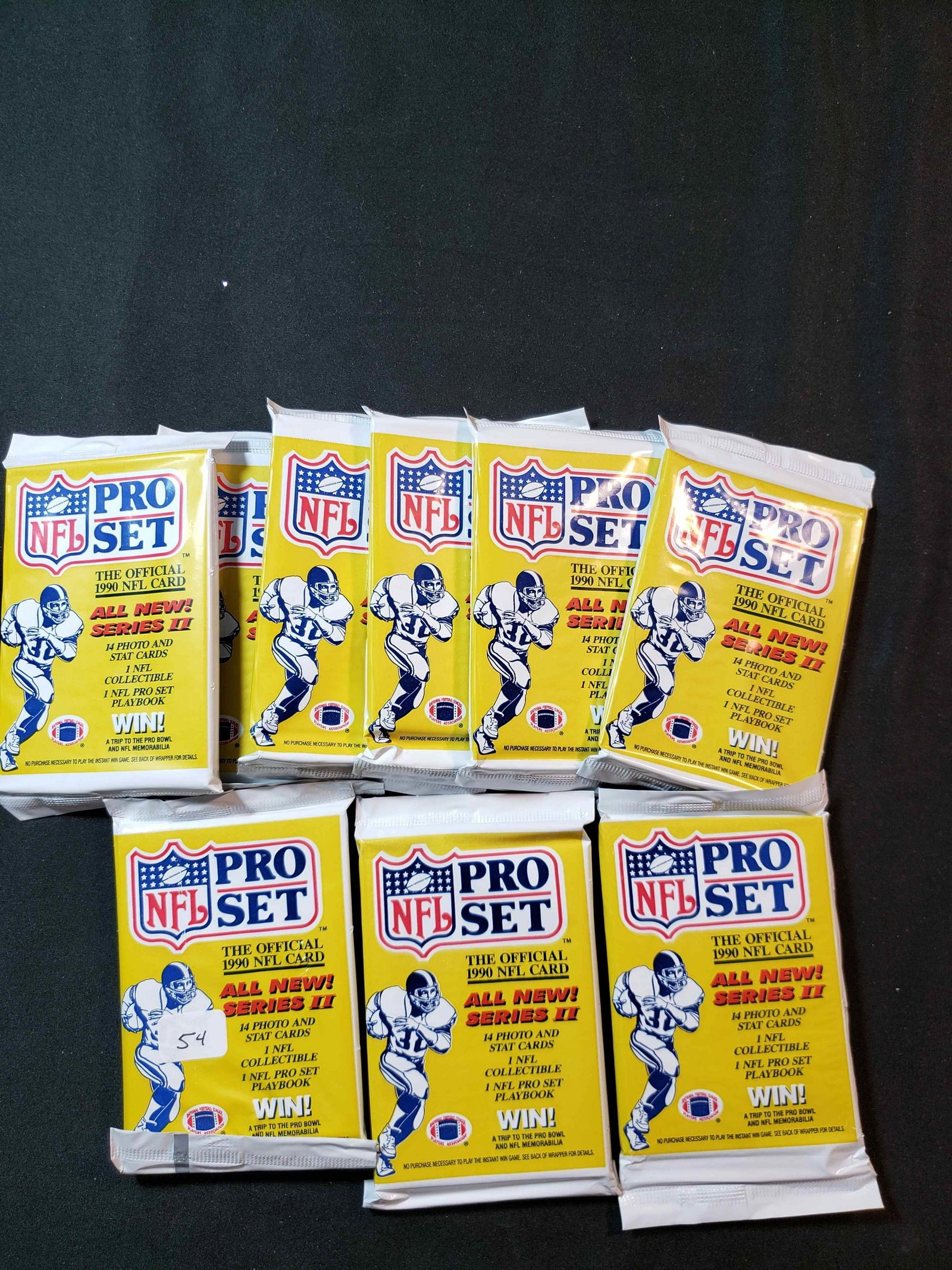 VINTAGE '90S UNOPENED FOOTBALL CARD PACKS: 1990 PRO SET FOOTBALL SERIES 2 (9) SEALED PACKS FIND EMMITT SMITH ROOKIE CARD #685 AND SANTA CLAUS SP CHASE CARDS