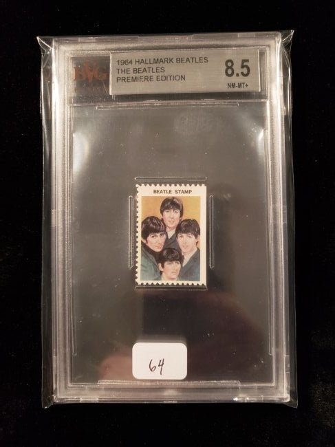 GRADED 1964 BEATLES HALLMARK COLLECTORS STAMP: 1964 HALLMARK BEATLES FAB FOUR WITH JOHN, PAUL, GEORGE AND RINGO PREMIERE EDITION COLLECTORS STAMP SLABBED AND GRADED 8.5/10 NM-MT+