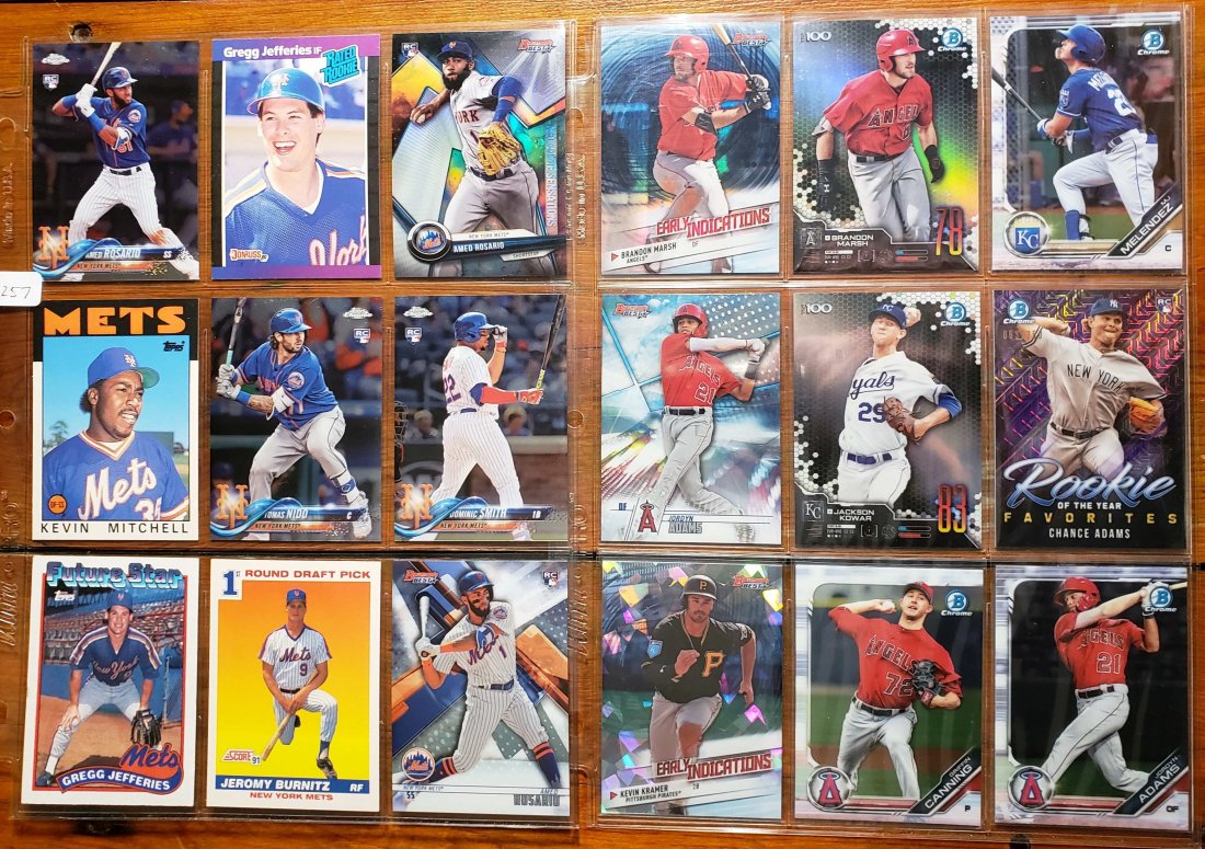2-BINDER PAGES OF ROOKIE BASEBALL CARDS: LOT OF 18 TOP ROOKIE AND PROSPECT CARDS IN MINT CONDITION.KEVIN MITCHELL, AMED ROSARIO, TOMAS NIDO, BRANDON MARSH, JACKSON KOWAR, JORDYN ADAMS.