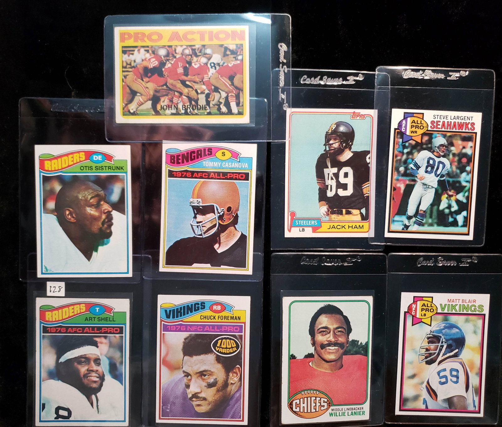 VINTAGE FOOTBALL CARDS STARS AND HOFERS: 1977 TOPPS FOOTBALL ART SHELL, OTIS SISTRUNK, CHUCK FOREMAN, TOMMY CASANOVA, 1976 WILLIE LANIER, 1972 JOHN BRODIE, 1981 JACK HAM, 1979 MATT BLAIR AND STEVE LARGENT