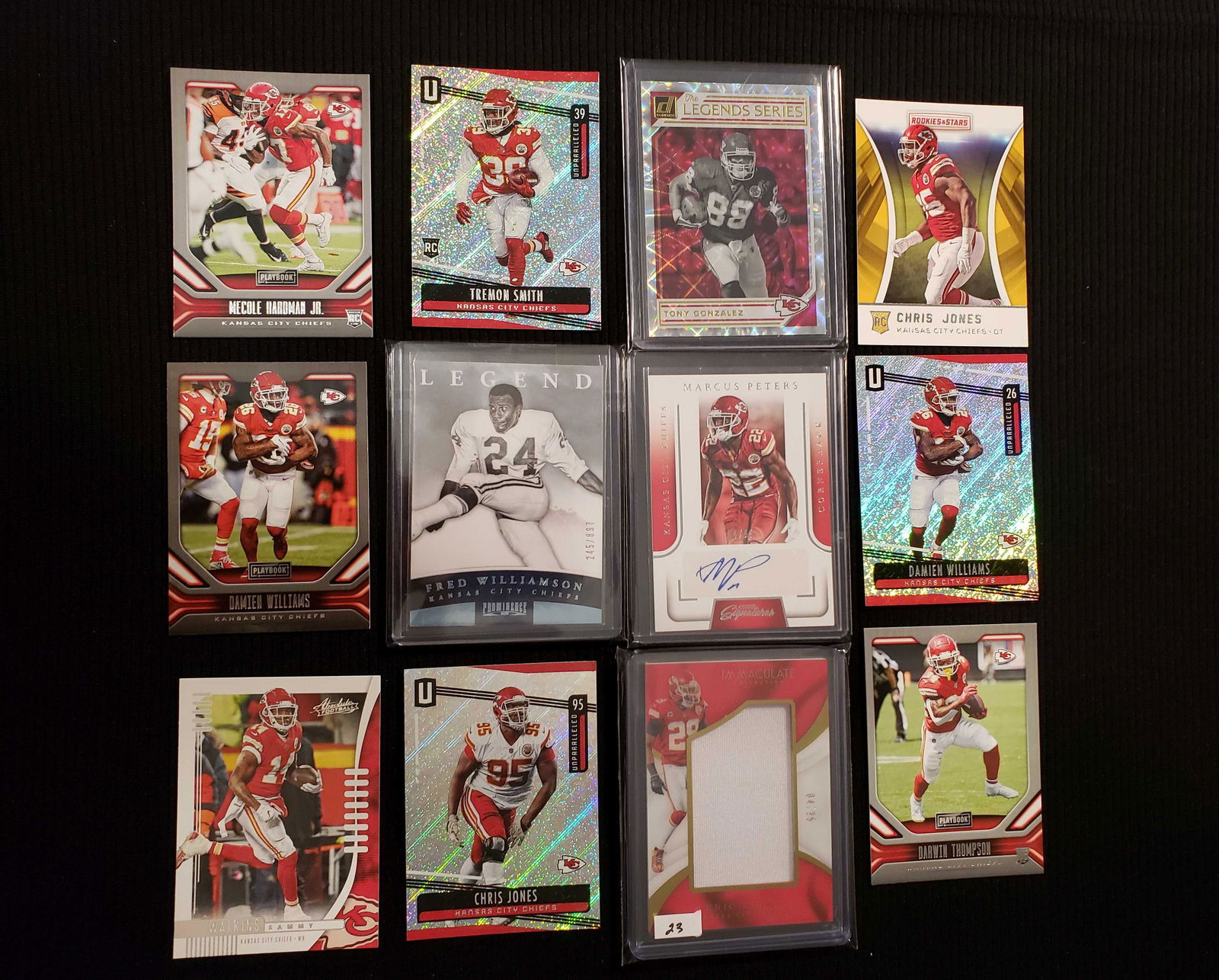 KANSAS CITY CHIEFS FOOTBALL CARD COLLECTION: NICE LOT HERE, ERIC BERRY JUMBO SSP JERSEY CARD 04/25, CHRIS JONES RC, MECOLE HARDMAN JR. RC, MARCUS PETERS AUTO, FRED WILLIAMSON LEGEND CARD, TONY GONZALES HOF GAME USED JERSEY CARD