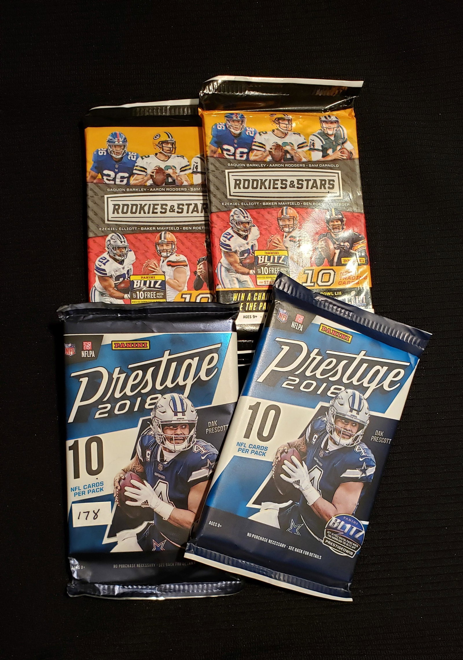 LOT OF 4 PANINI 2018 FOOTBALL CARD FOIL PACKS: 2-2018 PANINI ROOKIE AND STARS 2-2018 PANINI PRESTIGE FOOTBALL GREAT ROOKIE CLASS LAMAR JACKSON, MAYFIELD, DONALD, BARKLEY, CHUBB, ALLEN AND MORE