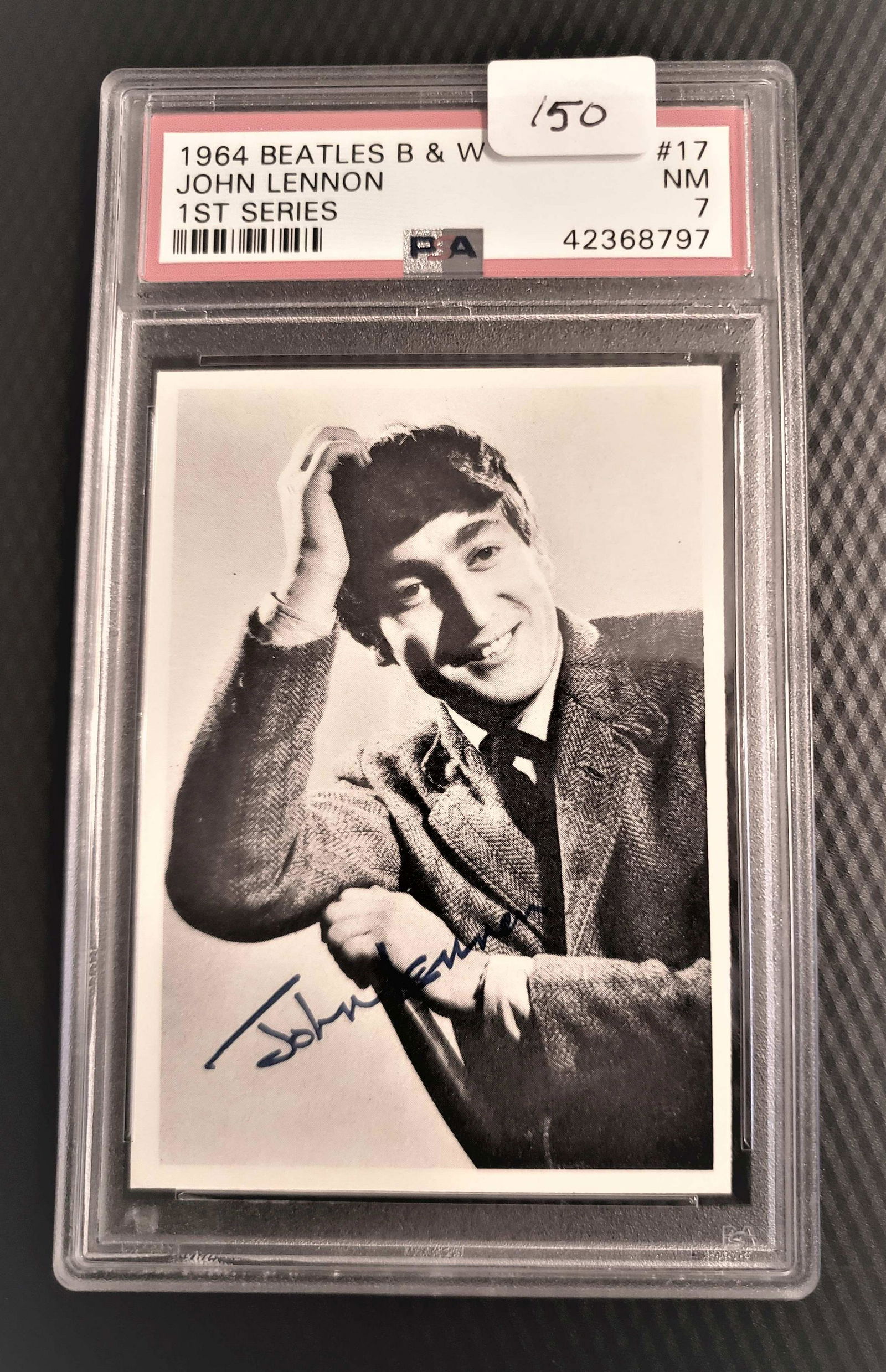 PSA GRADED 1964 BEATLES B&W JOHN LENNON 1ST SERIES: PSA 7 NEAR MINT ORIGINAL BLACK AND WHITE 1964 BEATLES TRADING CARD JOHN LENNON CARD #17