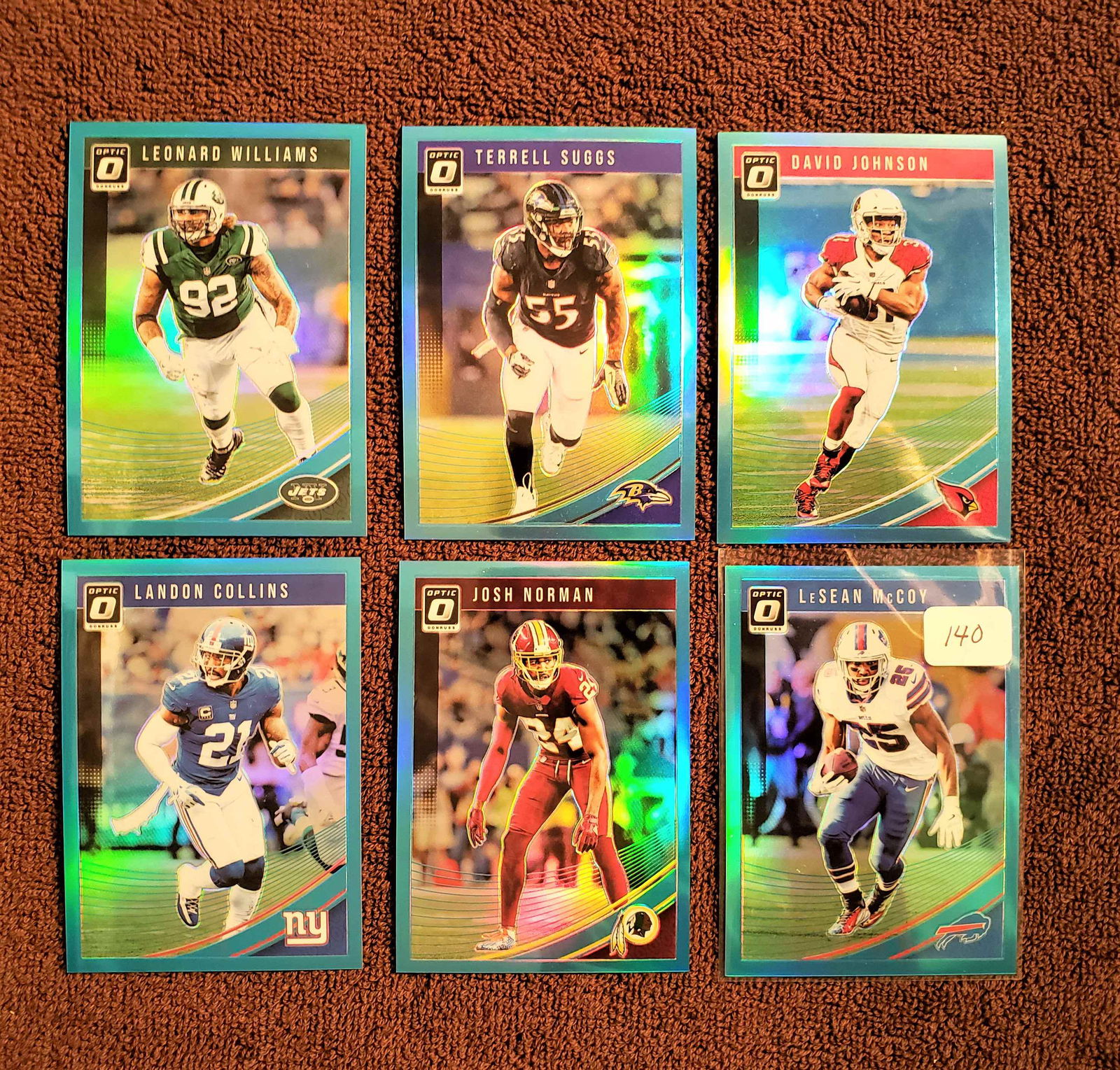 LOT OF 6 PANINI OPTIC BLUE HOLO PRIZM SPS #'D TO 299: SHADY MCCOY 001/299, DAVID JOHNSON 066/299, TERRELL SUGGS 157/299