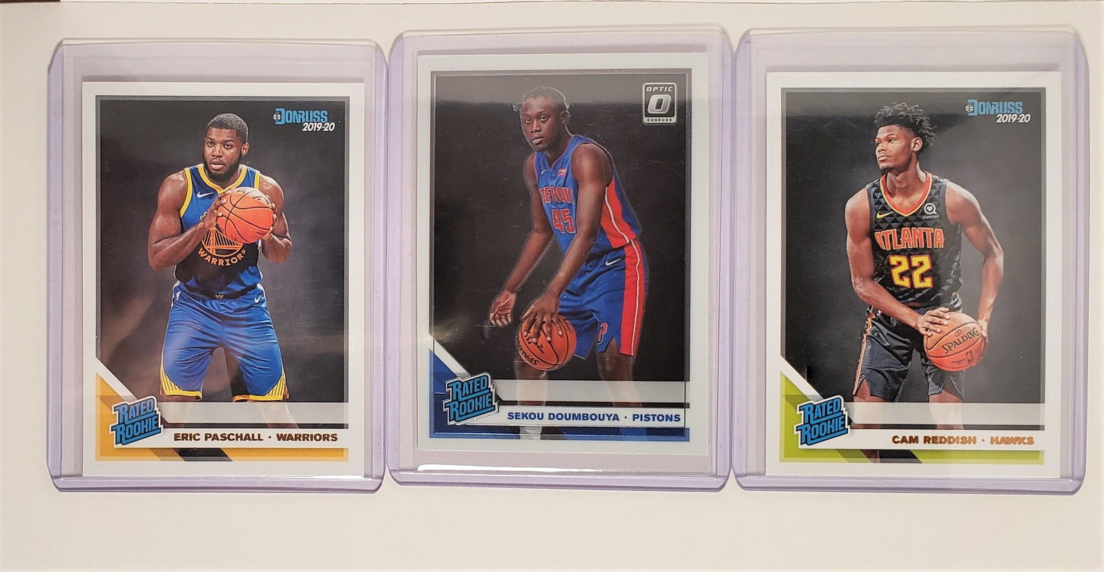 2019-20 OPTIC/DONRUSS RATED ROOKIES: ERIC PASCHAL, CAM REDDISH, SEKOU DOUMBOUYA