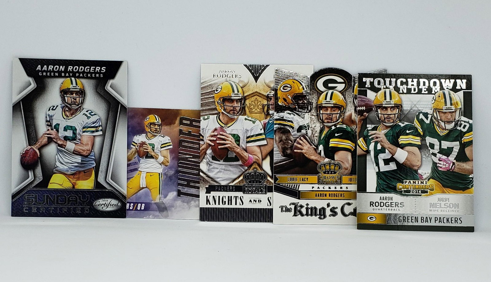 AARON RODGERS PACKERS INSERTS/PARALLELS: 10 DIFFERENT AARON RODGERS INSERT CARDS WITH 2014 CROWN ROYALE, R&S RED FOIL NAME PLATE