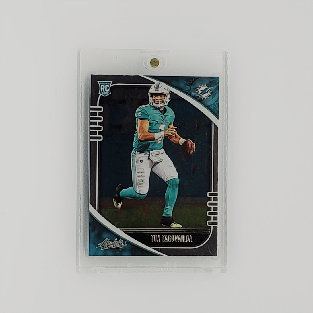 TUA TAGOVAILOA DOLPHINS ROOKIE CARD FOIL VERSION: 2020 PANINI ABSOLUTE FOOTBALL TUA TAGOVAILOA ROOKIE FOIL VARIATION IN ONE TOUCH HOLDER