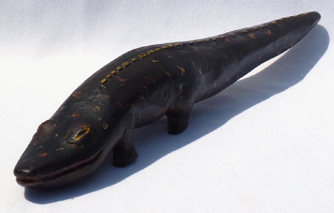 Fun, Folky painted carving of an alligator .: This is a fun and folky painted carving of an alligator . It is 14Â 1/2" long by about 2Â 1/4" wide by 2Â 1/4" high, in excellent condition. The age is unknown, but it is not very recent.