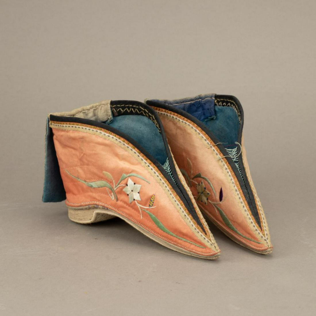 Pair of Silk Embroidered Shoes for Bound Feet: Pair of Silk Embroidered Shoes for Bound Feet Size: 6.5 in. (17 cm.) W x 2 in. (5 cm.) D x 3.25 in. (8.3 cm.) H http://www.karburys.com/lotdetail/841