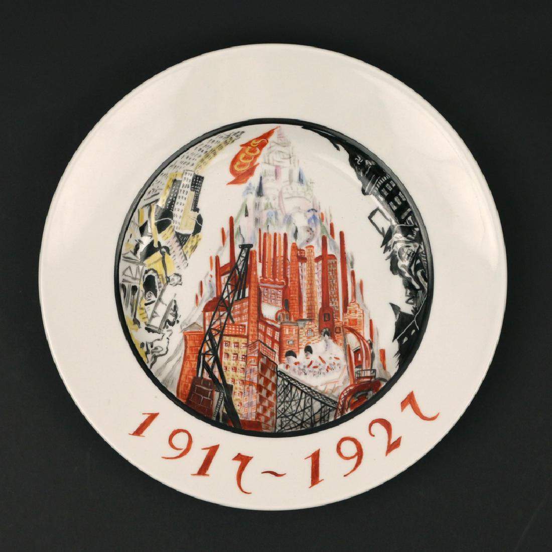 RUSSIAN SOVIET PROPOGANDA PLATE: 'The Way to Socialism' by Zinaida Kobyletskaya (1880-1957), painted with a receding pyramid of factories topped with a USSR flag and inscribed '1917-1927' underneath, the bottom with sickle and hammer