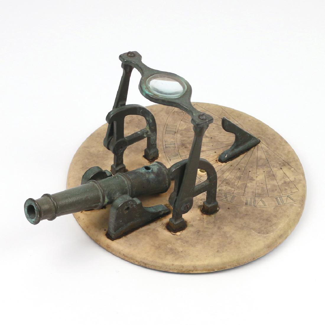 BRONZE 'NOON CANNON' SUNDIAL: with a composition base, no apparent maker's marks h. 6 w. 12 in. (over cannon) Condition: weathered