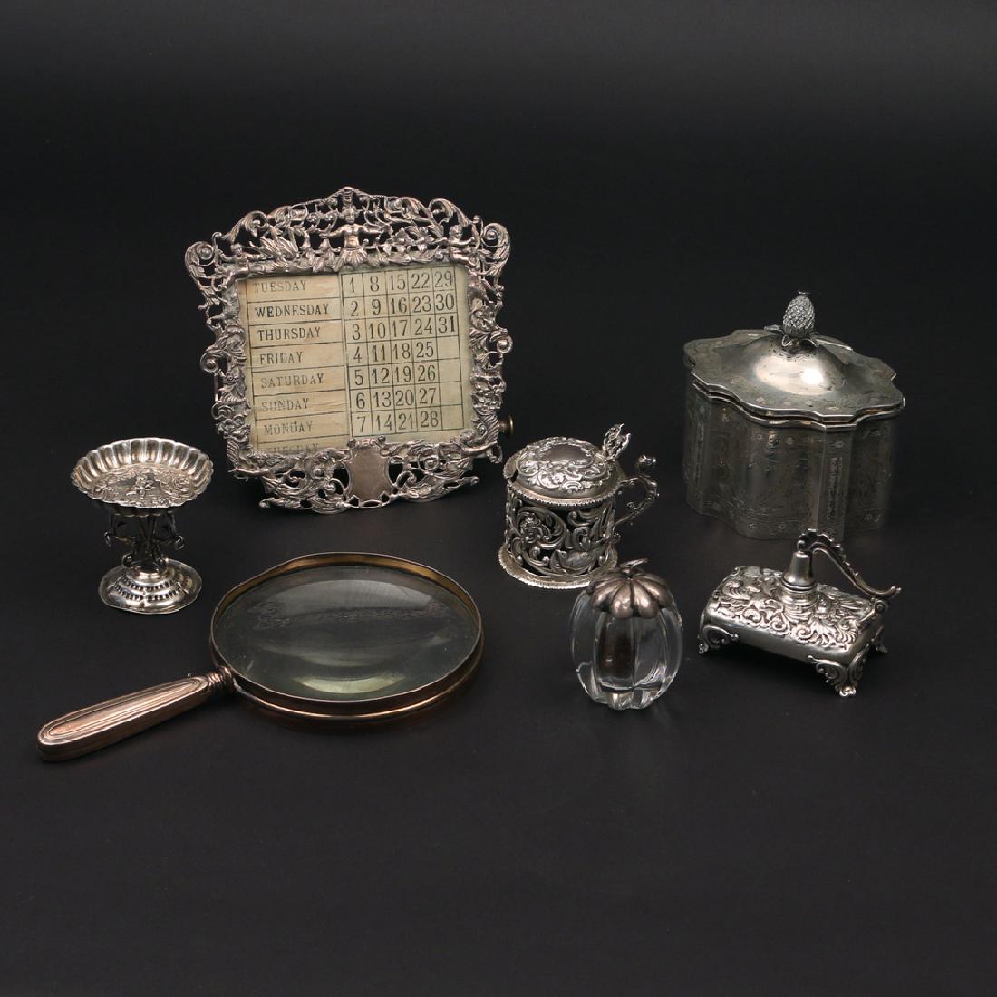 (7pc) SILVER DESK ITEMS: comprising a Black, Starr, and Frost sterling shaped lidded box with pineapple finial, w. 4-1/2 in.; a Macmichael English silver inkwell with cobalt liner; a sterling repousse low-form candle with snu