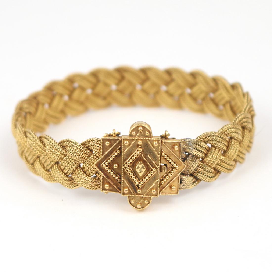 LADY'S WOVEN GOLD BRACELET: Designed as a (tested to) 14k braided gold bracelet teminating in an escutcheon form (l. 6 in, appx. 22g) Condition: [evidence of resizing by brazing at clasp]