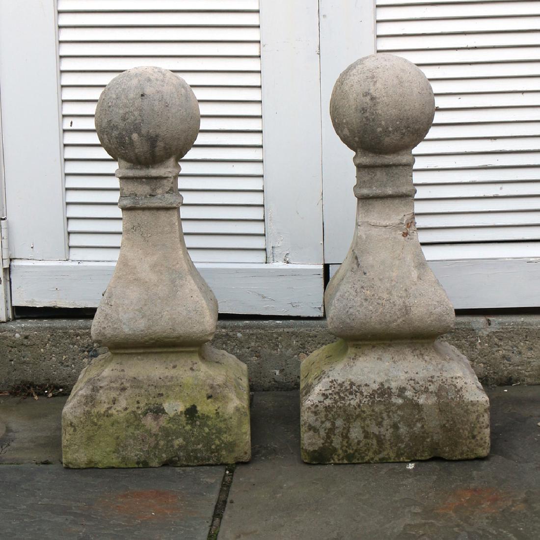 (2pc) PAIR LIMESTONE FINIALS: Designed as square tapering columns terminating in a sphere h. 24 in. Condition: [each with breaks and old repairs as pictured