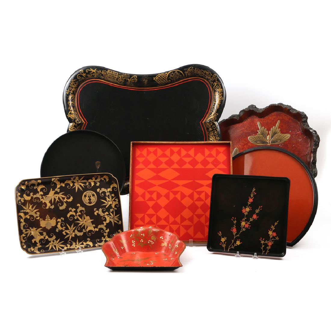 (8pc) MISC. TRAYS: Including a papier mache dustpan, a papier mache contoured serving tray (24 x 20 in.), a contemporary enameled metal and wood tray, a gilt decorated lacquered rectangular tray, a square lacquered tray