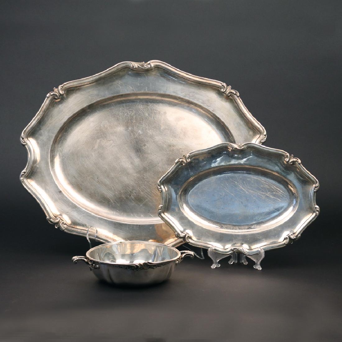 (3pc) CHRISTOFLE SILVER-PLATE: including a large serving tray with a shaped classical edge, a bread tray of the same design, and an open two-handled bowl (missing lid) h. 19 w. 15 in. (largest) Condition: with knife marks