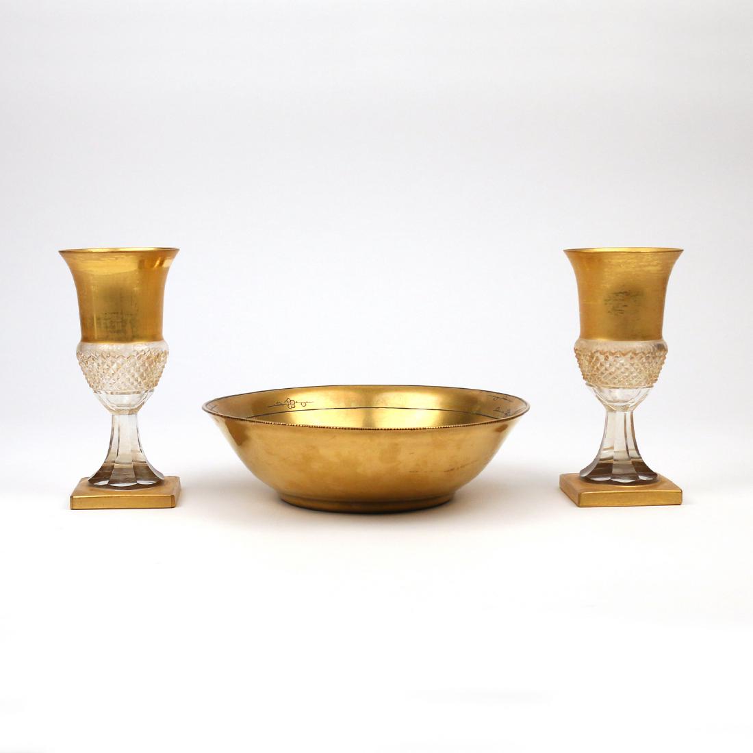 (3pc) GILT DECORATED GLASS & OTHER: Including two cut crystal goblets with gilt feet and rims (h. 7-1/2 in.), and a Sidney Callowhill gilt and painted arts-and-crafts period bowl (dia. 9-1/2 in.) Provenance: Estate of the late Elizabeth