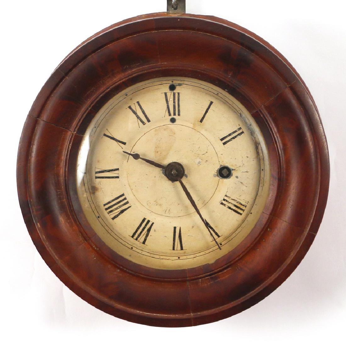 KIRK'S PATENT MARINE TIMEPIECE: New Haven, Connecticut, c. 1850, with a zinc dial and mahogany case, with label on interior, remnants of signature on face, d. 9-1/2 in.