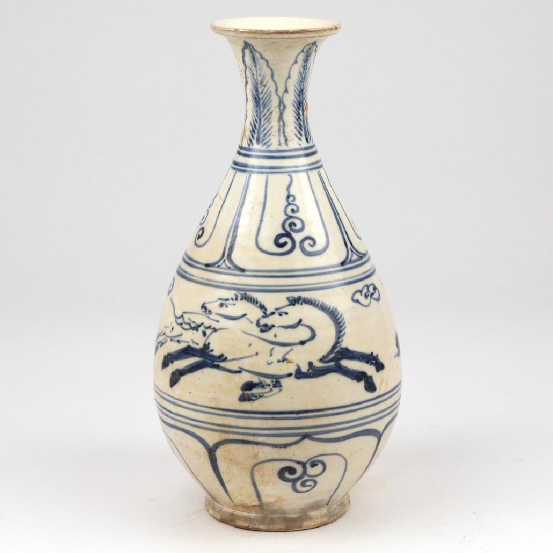 VIETNAMESE BLUE & WHITE 'YUHUCHUN' VASE: 16th Century or later, with petal lappet borders and a central band showing two pairs of regardant horses at gallop, the creamy-white glaze ending at the footrim, unglazed base revealing a light brown